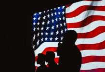 Trump Rules Out Nuclear Weapons, Ground Troops in Iran People next to USA Flag
