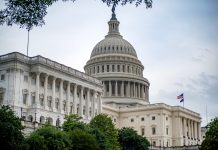 Sen. Ossoff Campaigns for Georgia Re-election, Denies 2028 Run Iconic US Capitol Building, a symbol of American democracy, viewed from a scenic vantage point in Washington D.C.